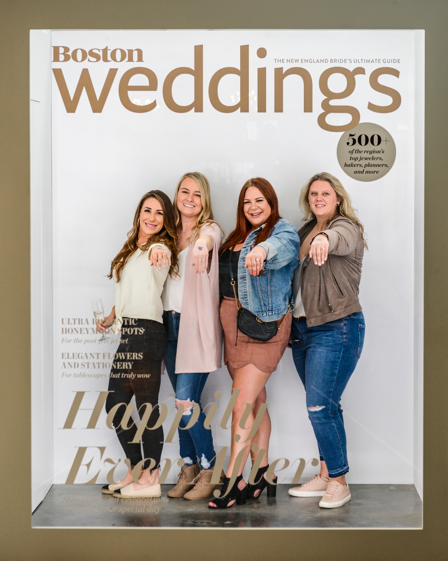 Guests posing in Boston Weddings magazine cover photo booth on Cape Cod