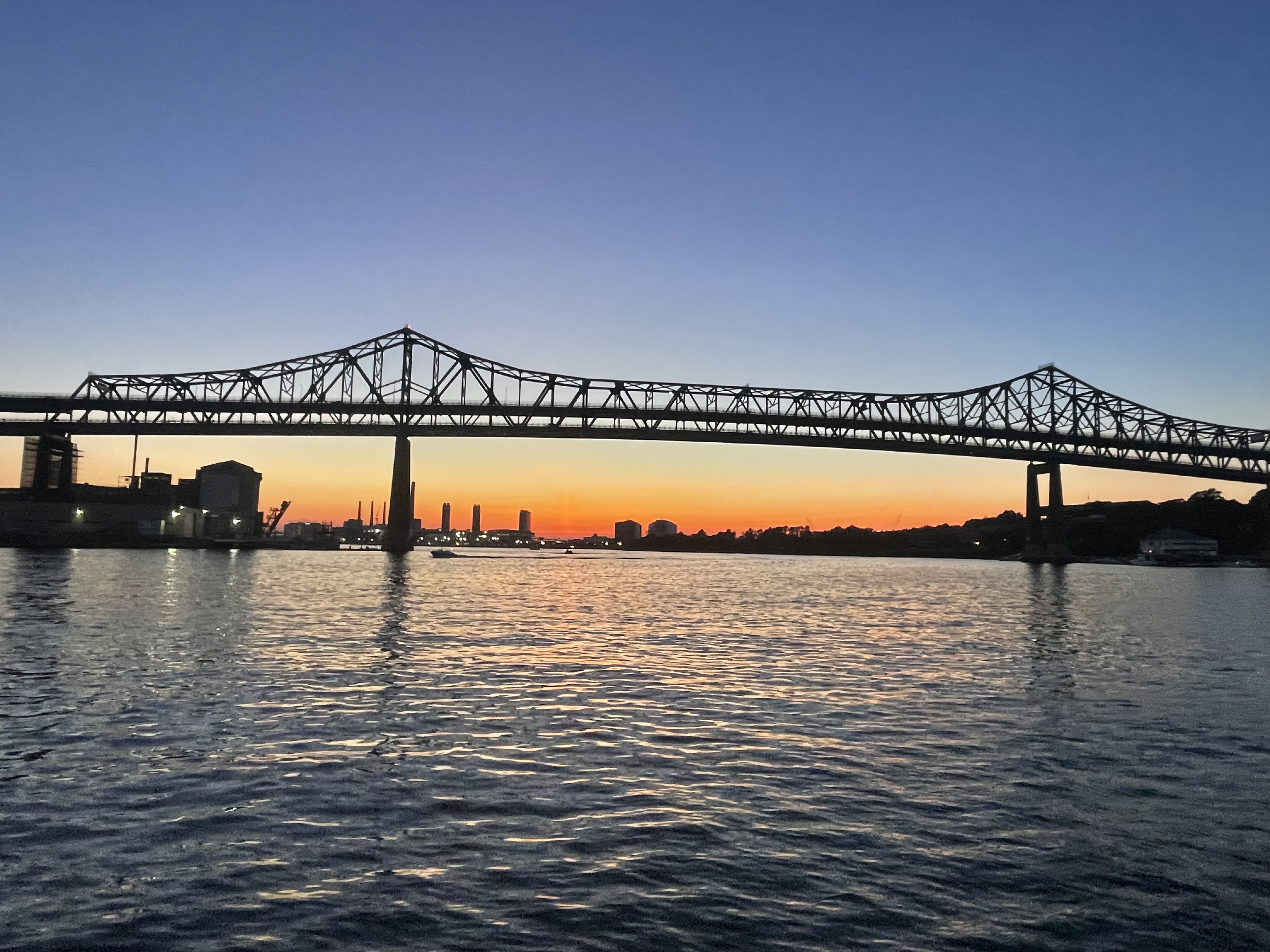 Boston Harbor charter boat at sunset