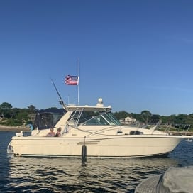 The Boston Belle yacht with guests on deck enjoying the view